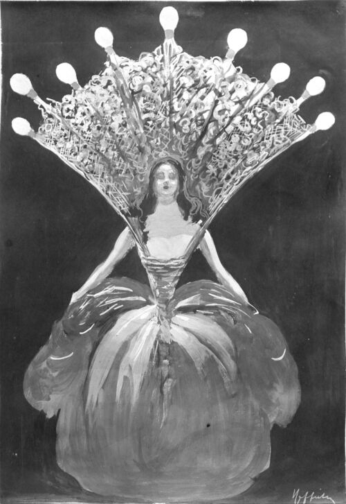 1905 ca. - La reine des fées porte une collerette agrémentée de neuf ampoules électriques allumées.